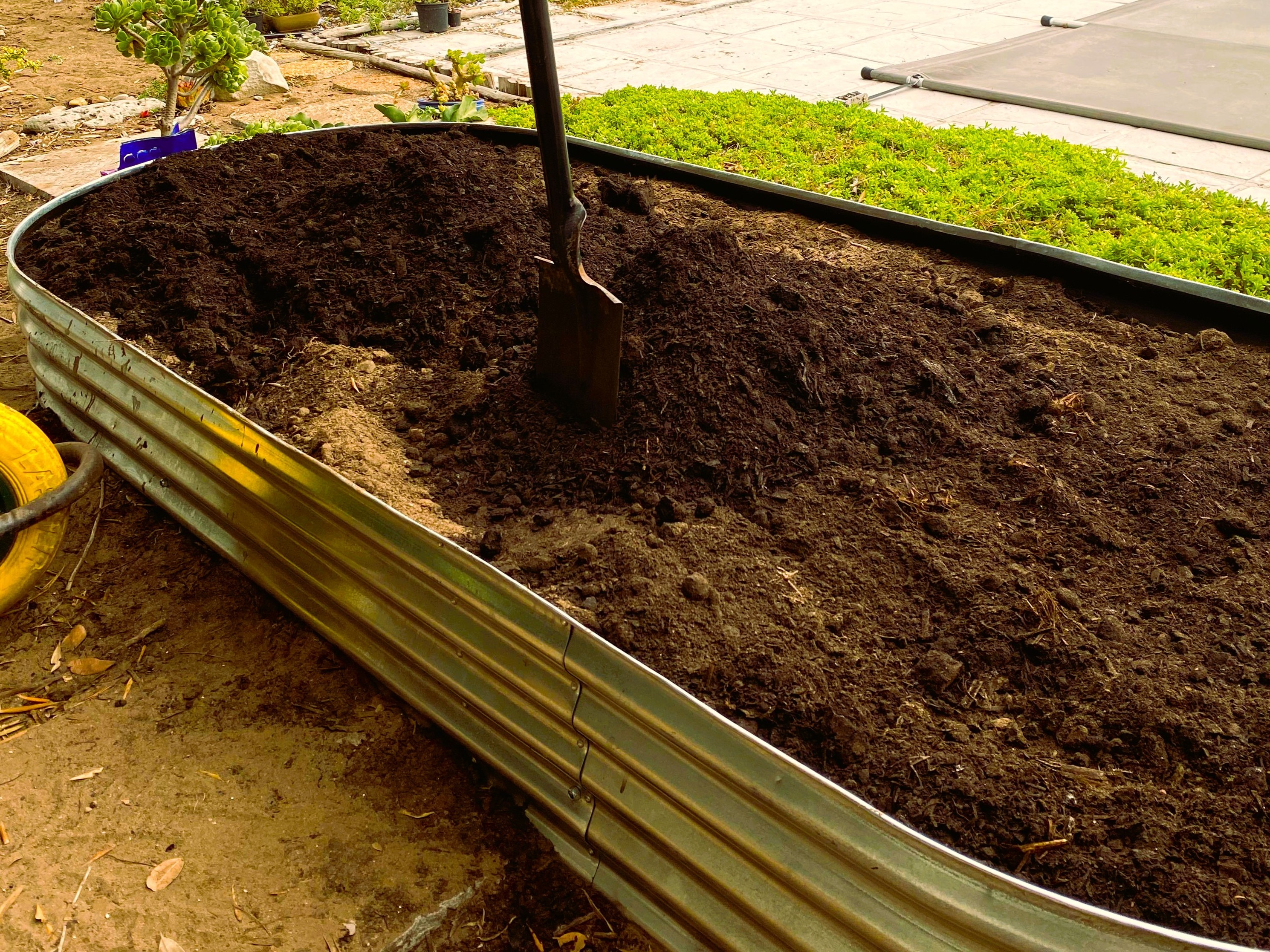Top layer of Compost filling raised bed affordable